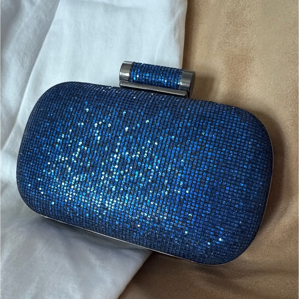 Sparkle blue clutch w/ inner pocket and two chain lengths.